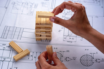 Architect working on blueprint. Architects workplace - architectural project, blueprints, laptop...