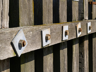 Wooden dock breakwall in a marina harbour
