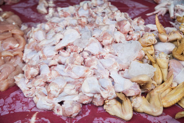 Raw chicken drumstsicks in the market Thailand