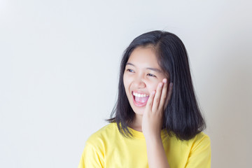Fototapeta premium Surprised excited girl on white background. Cheerful multiracial