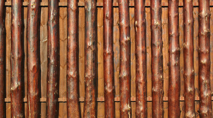 Wooden fence of oak tree trunks