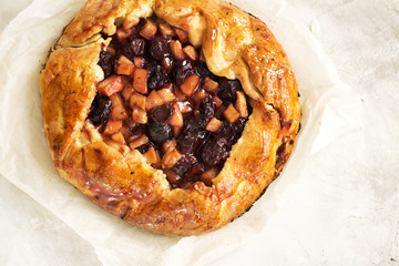 Apple and cherry pie with ingredients