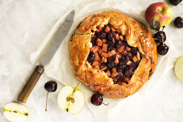 Apple and cherry pie with ingredients