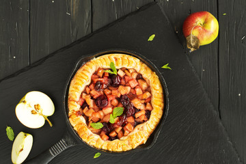 Apple and cherry pie with ingredients