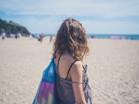 Young woman going to the beach