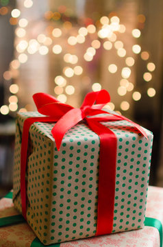 christmas gifts indoor on defocused lights background space for text