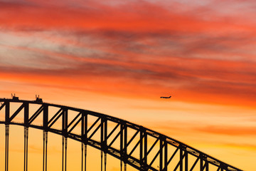Colorful dramatic sky with silhouette of Sydney Harbour Bridge