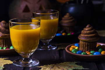 Halloween cocktail, pumpkin orange drink with spices