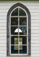 Old church window on white wall