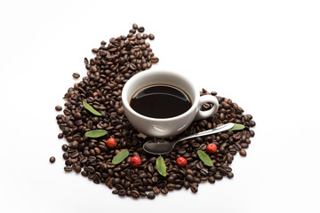 Cup with coffee and coffee beans