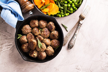 Beef meatballs in an iron skillet