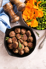 Beef meatballs in an iron skillet