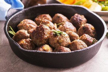 Beef meatballs in an iron skillet