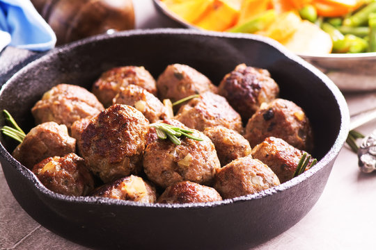 Beef meatballs in an iron skillet