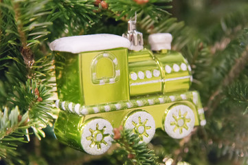 Christmas decorative toy locomotive on a fir tree