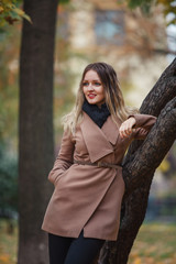 Beautiful girl in autumn Park