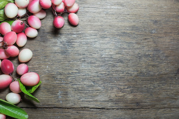 Carunda or Karonda on wood background