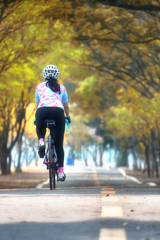 Sportswoman ride bike, keep going idea