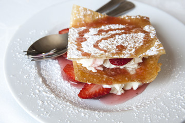 Millefeuille with strawberries and powdered sugar