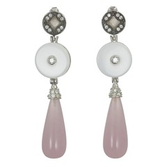 Silver earrings with pink and white stones isolated on white