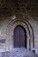 Fototapeta na wymiar sight of the entry of the Romanesque collegiate church of San Salvador in Cantamuda in Palencia, Castile and León, Spain