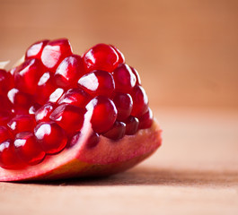 ripe pomegranate on wood background. 