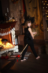 Obraz na płótnie Canvas crazy Girl witch with broom . childhood Halloween