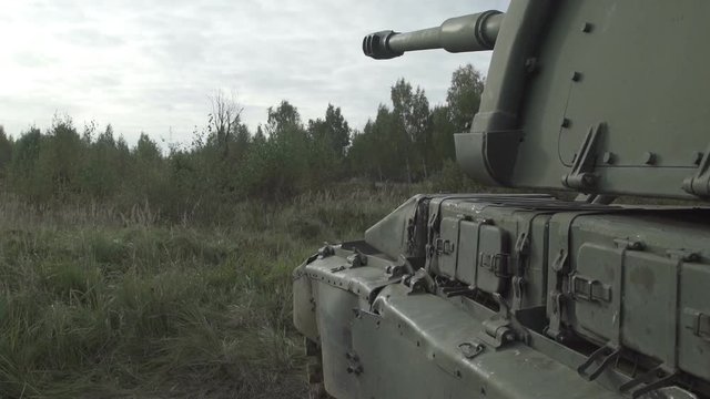 Self-propelled artillery unit in the stands. Military armored vehicles.