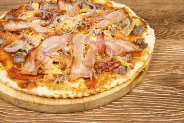 Delicious fresh pizza served on wooden table.