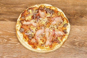 Delicious fresh pizza served on wooden table.