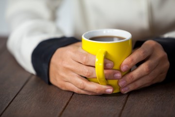 Woman holding a cup of coffee