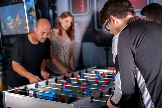 Friends Playing Table Foosball