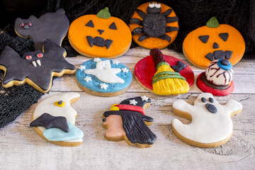 Fototapeta na wymiar Delicious halloween cookies on wooden background