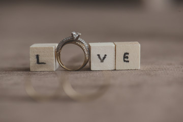 Wedding and engagement rings with inscription love