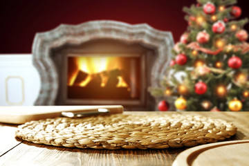 Obraz premium wooden table place and xmas tree 