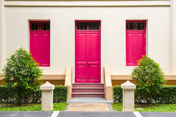 pink Door , pink window on Cream Wall on pink staircase with sma