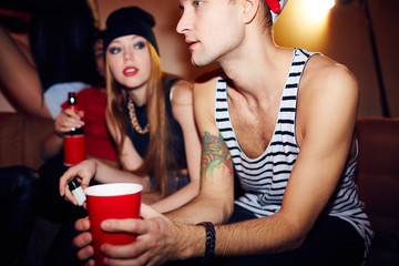 Young People Hanging Out in Club Lounge