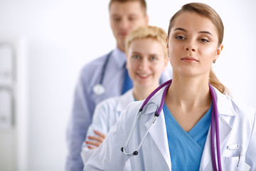 Portrait of doctor in front of colleagues