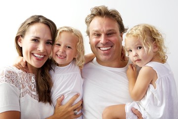 Happy young family smiling together