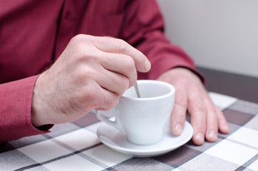 tea cup in man's hands