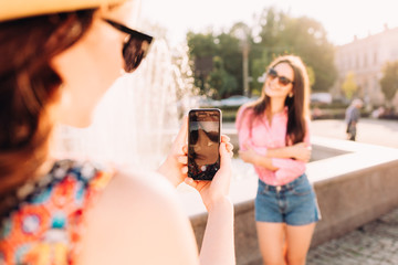 happy girls make picture together and having fun,laughing and make funny faces on camera