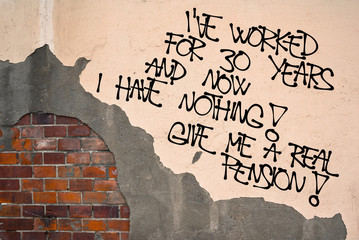 I Have Worked For 30 Years And Now I Have Nothing. Give Me A Real Pension - handwritten graffiti sprayed on the wall - problem of retired people because of small welfare benefit
