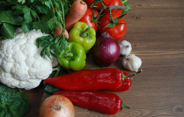 Healthy organic vegetables on brown wooden table