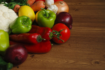 Healthy organic vegetables on brown wooden table