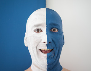 Blue and white face portait photo of a man