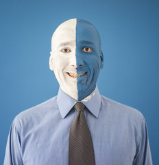 Blue and white face portait photo of a man