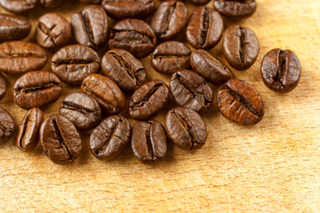 Fresh roasted coffee beans on a wooden board