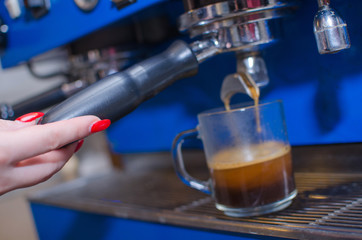 Fototapeta na wymiar Woman making coffee