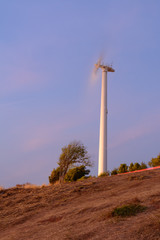 Wind turbine power generator at night