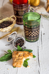 Arabic nana mint tea in traditional glass with mint